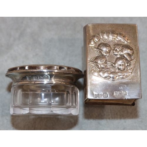 230 - A Birmingham silver matchbox case holder with embossed cupid decoration and a small cut glass dressi... 