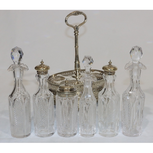 240 - An oval cut glass and silver plated claret jug, an oval silver plated cruet stand with centre carryi... 