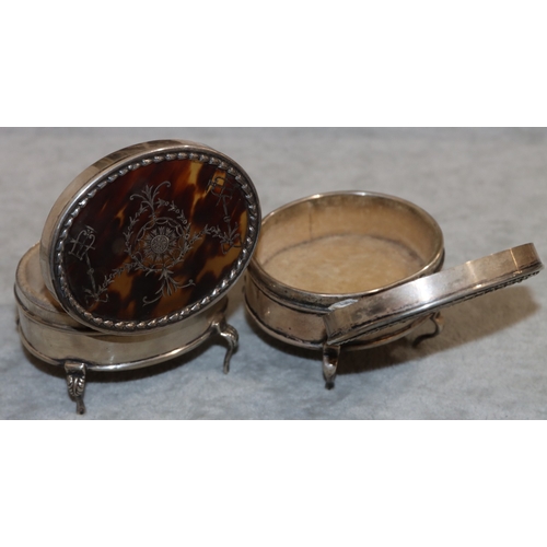 252 - 2 near matching George V oval silver trinket boxes with hinged tortoiseshell lids, on 4 splayed legs... 