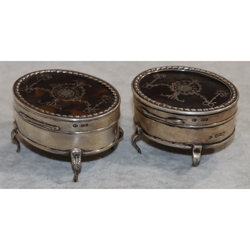 252 - 2 near matching George V oval silver trinket boxes with hinged tortoiseshell lids, on 4 splayed legs... 