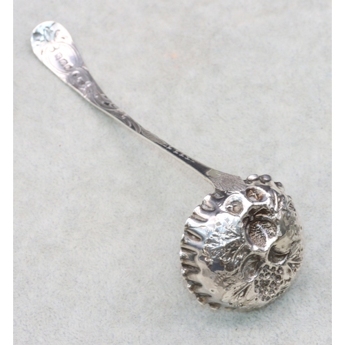 282 - A George IV Scottish silver sifter ladle with embossed fruit and leaf decoration and crinkled rim, E... 