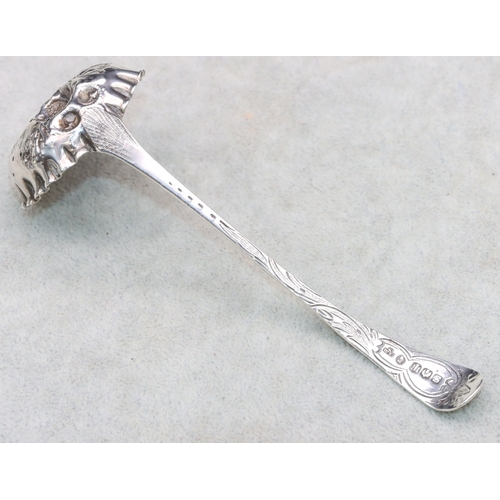 282 - A George IV Scottish silver sifter ladle with embossed fruit and leaf decoration and crinkled rim, E... 