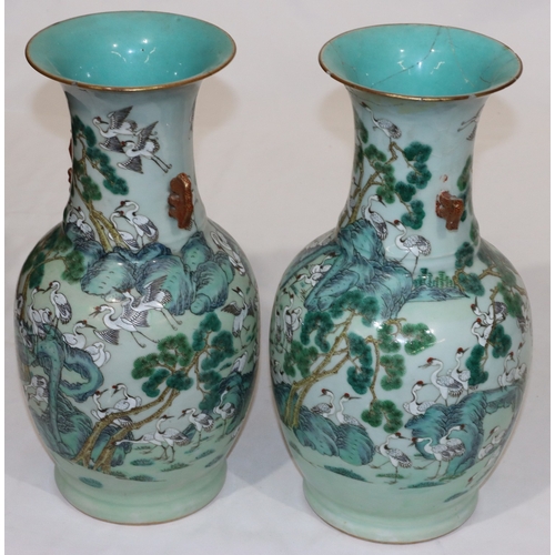 32 - A pair of 19th/20th Century Chinese round bulbous thin necked trumpet shaped 2-handled vases with mu... 