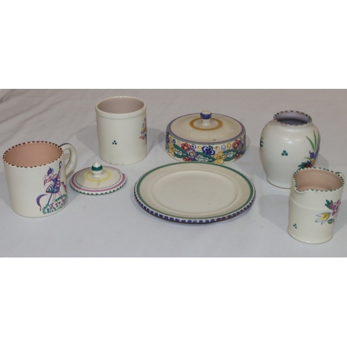 38 - 5 Poole Pottery items, including a mug with coloured figure decoration, a lidded butter dish, a lidd... 