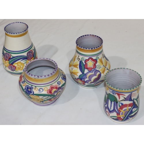 45 - 4 various Poole round bulbous shaped vases with multi-coloured floral, leaf and scroll decoration, l... 