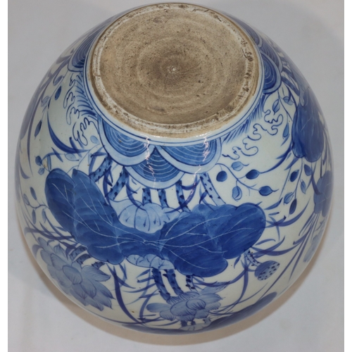 52 - An Oriental round bulbous thin necked vase on blue and white ground with bird, insect, floral and le... 