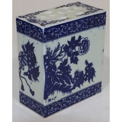 56 - An Oriental blue and white rectangular shaped pillow with animal, floral, leaf and scroll decoration... 