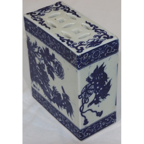 56 - An Oriental blue and white rectangular shaped pillow with animal, floral, leaf and scroll decoration... 