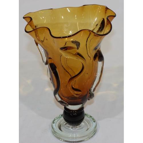 59 - An amber and clear glass round handkerchief vase with raised scroll decoration, 29cm high