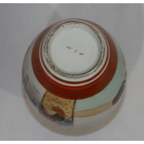 60 - A Japanese small round bulbous thin  necked vase on white and red ground with multi-coloured figure,... 