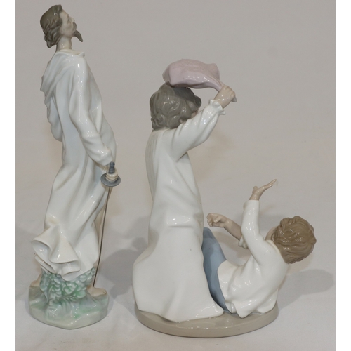 61 - A Nao group of 2 children having a pillow fight, 24cm high and a Lladro figure of Don Quixote (hat l... 