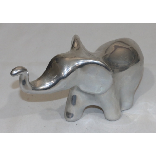 687 - Hoselton, Canadian aluminium sculpture of an elephant, labelled and signed with number 2046, 10.5cm ... 