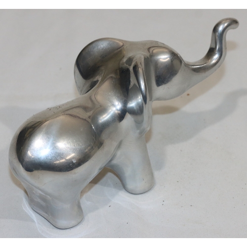 687 - Hoselton, Canadian aluminium sculpture of an elephant, labelled and signed with number 2046, 10.5cm ... 