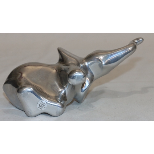 687 - Hoselton, Canadian aluminium sculpture of an elephant, labelled and signed with number 2046, 10.5cm ... 