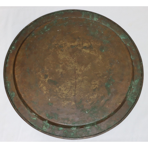 688 - An Eastern brass circular tray with raised inlaid silvered and copper inscription, floral and scroll... 