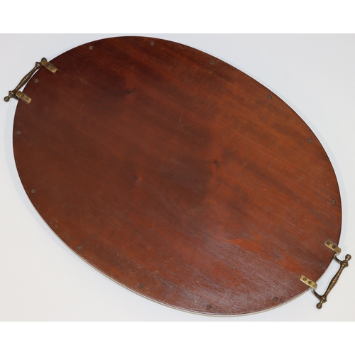 691 - An Edwardian mahogany oval tray with brass handles, inlaid marquetry centre with acorn and leaf deco... 