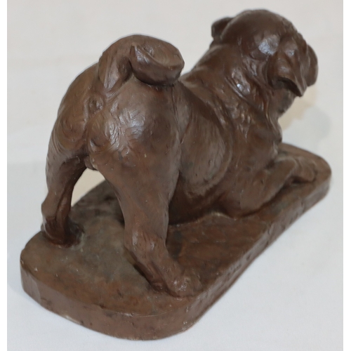 692 - A bronze resin figure of a pug on rectangular shaped base, 12cm high