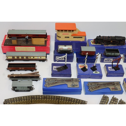 693 - A quantity of Hornby Dublo engines, trucks, carriages, signal cabin, track etc.