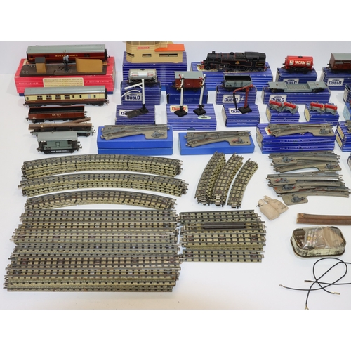 693 - A quantity of Hornby Dublo engines, trucks, carriages, signal cabin, track etc.