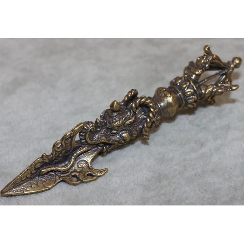 700 - A gilt metal small dagger with raised dragon decoration, 11cm long