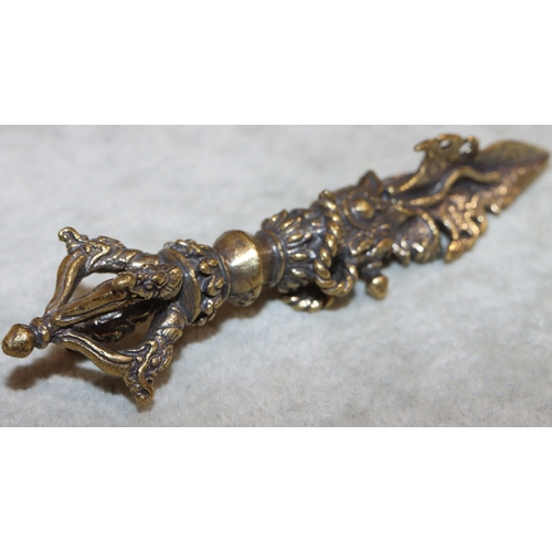 700 - A gilt metal small dagger with raised dragon decoration, 11cm long