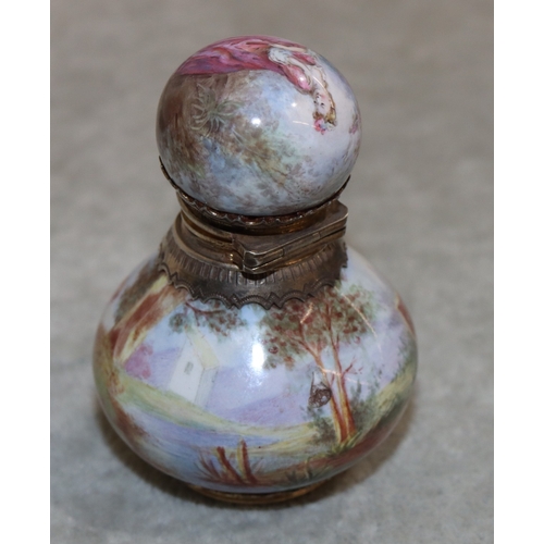 737 - A Continental enamelled and silver coloured metal small round bulbous shaped scent bottle with hinge... 