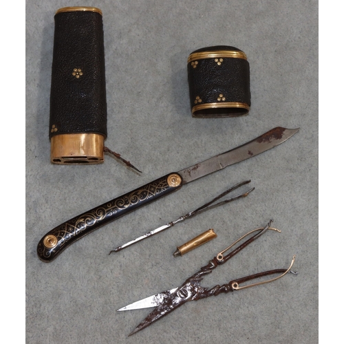 739 - A Shagreen and gilt metal etui with cover enclosing folding scissors, tortoiseshell penknife, tweeze... 