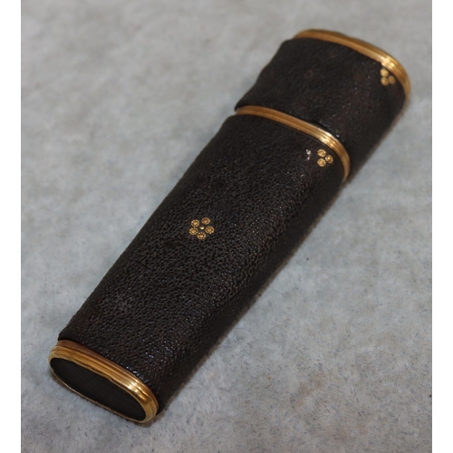 739 - A Shagreen and gilt metal etui with cover enclosing folding scissors, tortoiseshell penknife, tweeze... 