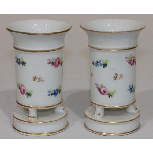 75 - A pair of 19th Century round trumpet shaped vases on white ground with hand painted floral, leaf and... 