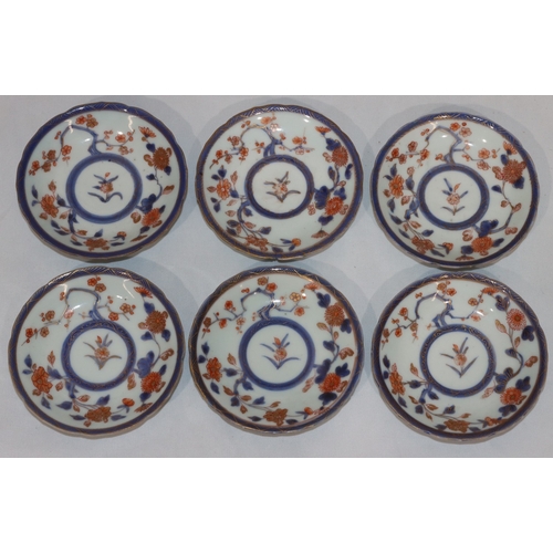 78 - A set of 6 19th Century Oriental Imari pattern small round dishes on white, blue and red ground with... 