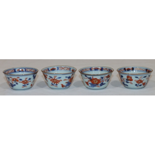 79 - A set of 4 19th Century Oriental Imari pattern round trumpet shaped tea bowls on white, red and blue... 