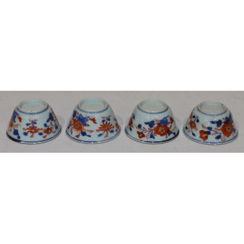 79 - A set of 4 19th Century Oriental Imari pattern round trumpet shaped tea bowls on white, red and blue... 