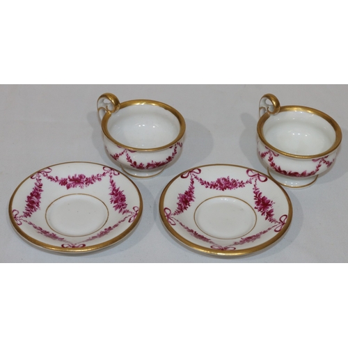 82 - A pair of 18th/19th Century Copenhagen small cups and saucers on white ground with puce floral, swag... 