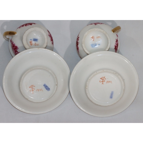 82 - A pair of 18th/19th Century Copenhagen small cups and saucers on white ground with puce floral, swag... 