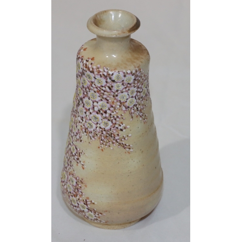 88 - An Oriental 20th Century round bulbous thin necked vase with multi-coloured floral and leaf decorati... 