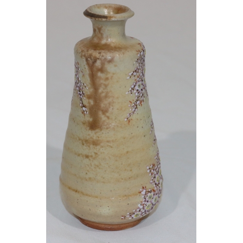 88 - An Oriental 20th Century round bulbous thin necked vase with multi-coloured floral and leaf decorati... 