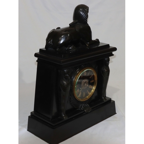 898 - A heavy black slate 8-day striking mantel clock with marble Egyptian sphinx to top, black dial surro... 