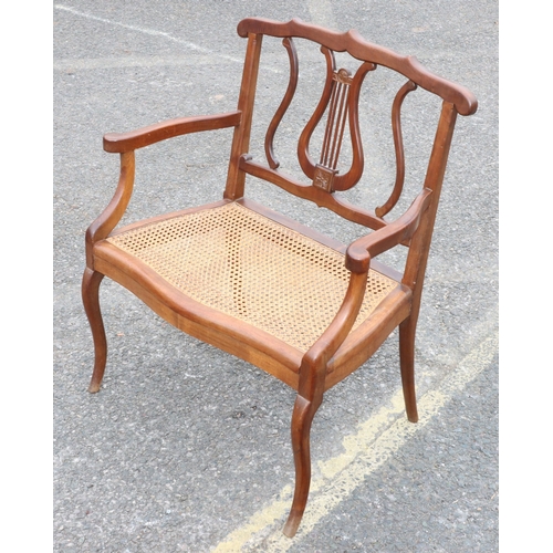 920 - A child's small settee with lyre back, cane seat, on cabriole legs, 60cm wide, 73.5cm high