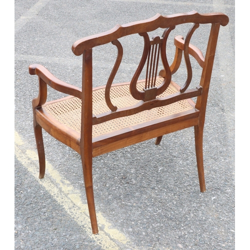 920 - A child's small settee with lyre back, cane seat, on cabriole legs, 60cm wide, 73.5cm high