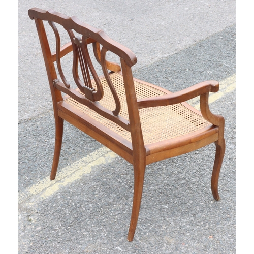 920 - A child's small settee with lyre back, cane seat, on cabriole legs, 60cm wide, 73.5cm high