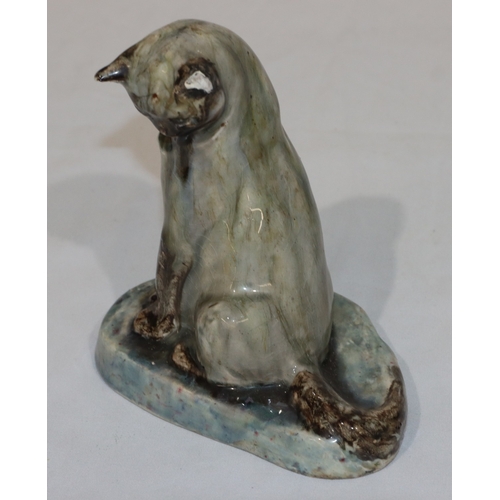 104 - Stella Rebecca Crofts (1898-1964) glazed model of a seated cat, 14.5cm high (1 ear a/f)