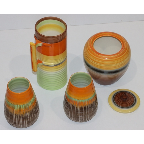 106 - A pair of Shelley round bulbous ringed Art Deco style vases with brown and orange decoration, 15cm h... 