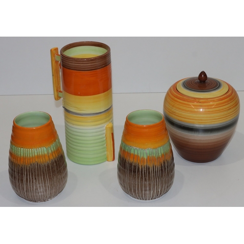 106 - A pair of Shelley round bulbous ringed Art Deco style vases with brown and orange decoration, 15cm h... 