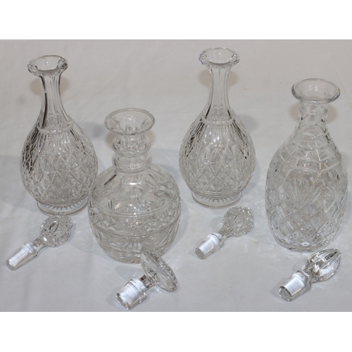 19 - A pair of cut glass round bulbous thin necked decanters with stoppers, 28.5cm high and 2 further hea... 