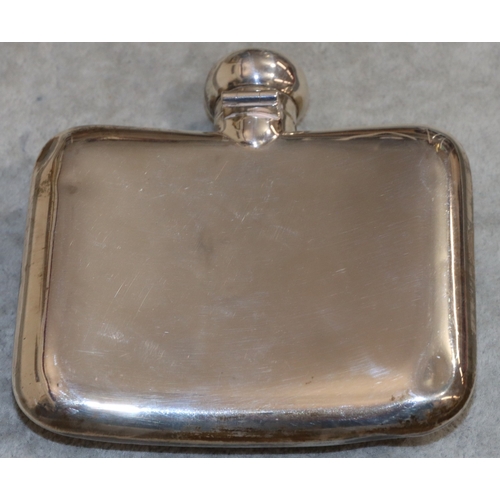 191 - A Chester silver concave shaped hip flask with screw hinged top, engraved monogrammed front, 11cm wi... 