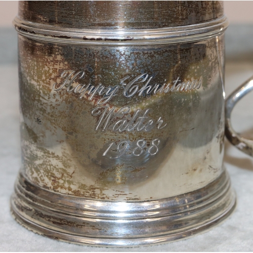 192 - A London silver christening mug with scroll handle, engraved presentation, 10cm high, 7.3oz