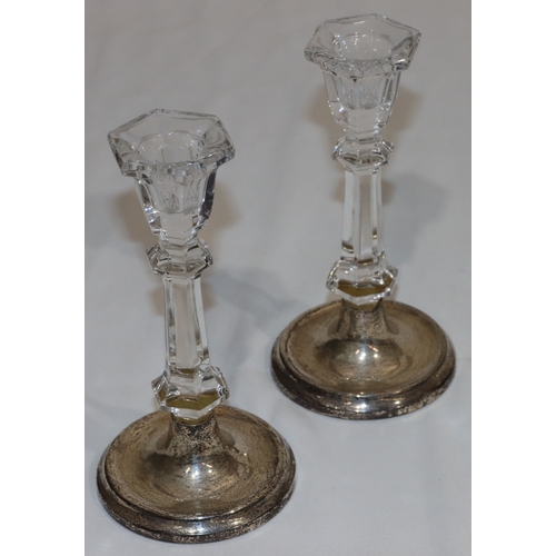 197 - A pair of cut glass candlesticks on Birmingham silver round splayed bases, 15.5cm high