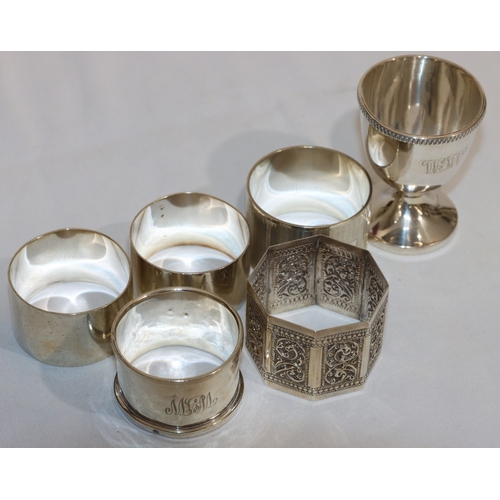 198 - 4 various silver round napkin rings, an Eastern silver coloured metal napkin ring and a Birmingham s... 