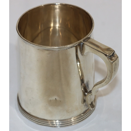 201 - A Birmingham plain silver christening mug with scroll handle, engraved monogram, maker's mark H&H, 8... 