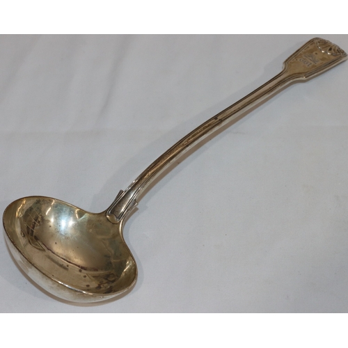 202 - A William IV silver soup ladle with engraved crest, 10.9oz